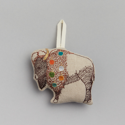 Coral and Tusk's "Bison" embroidered linen Christmas ornament featuring design of a festive bison decorated with ornaments