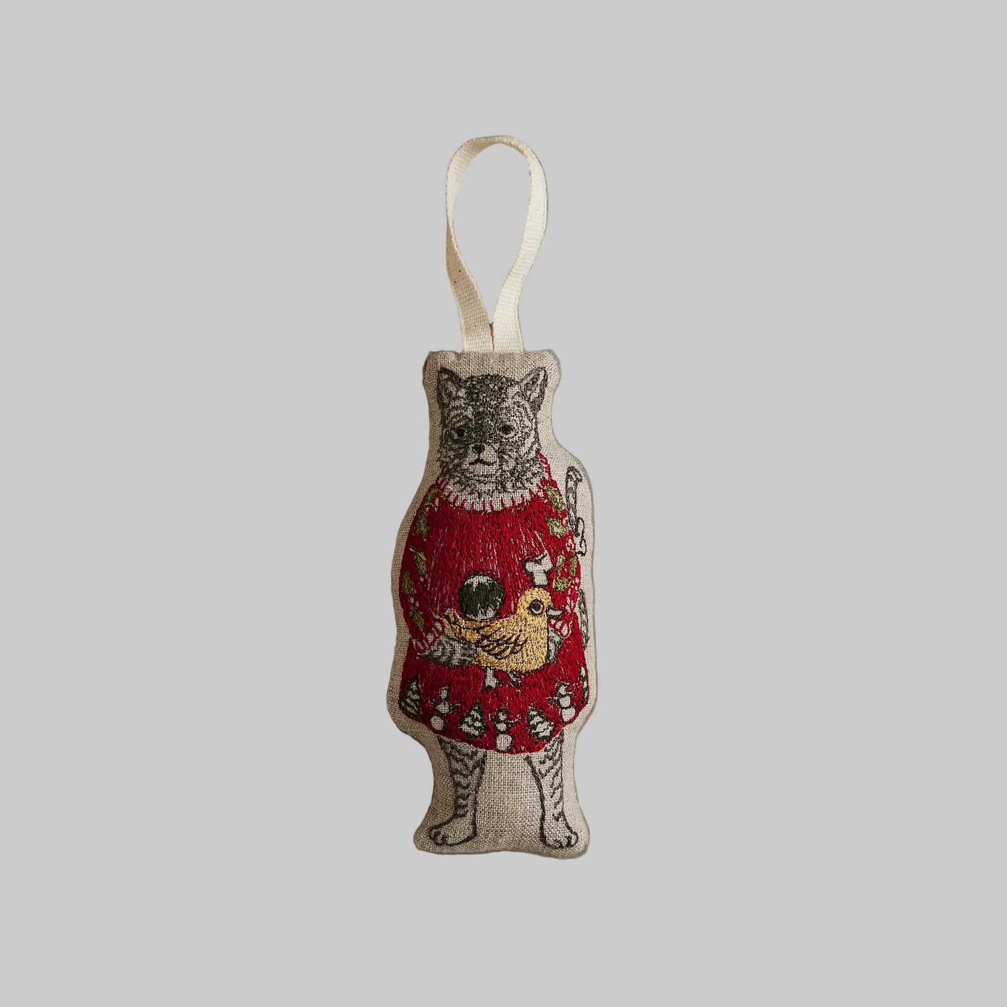Coral and Tusk's "Cat with Gifts" embroidered linen Christmas ornament featuring design of a cat in a red dress holding some gifts