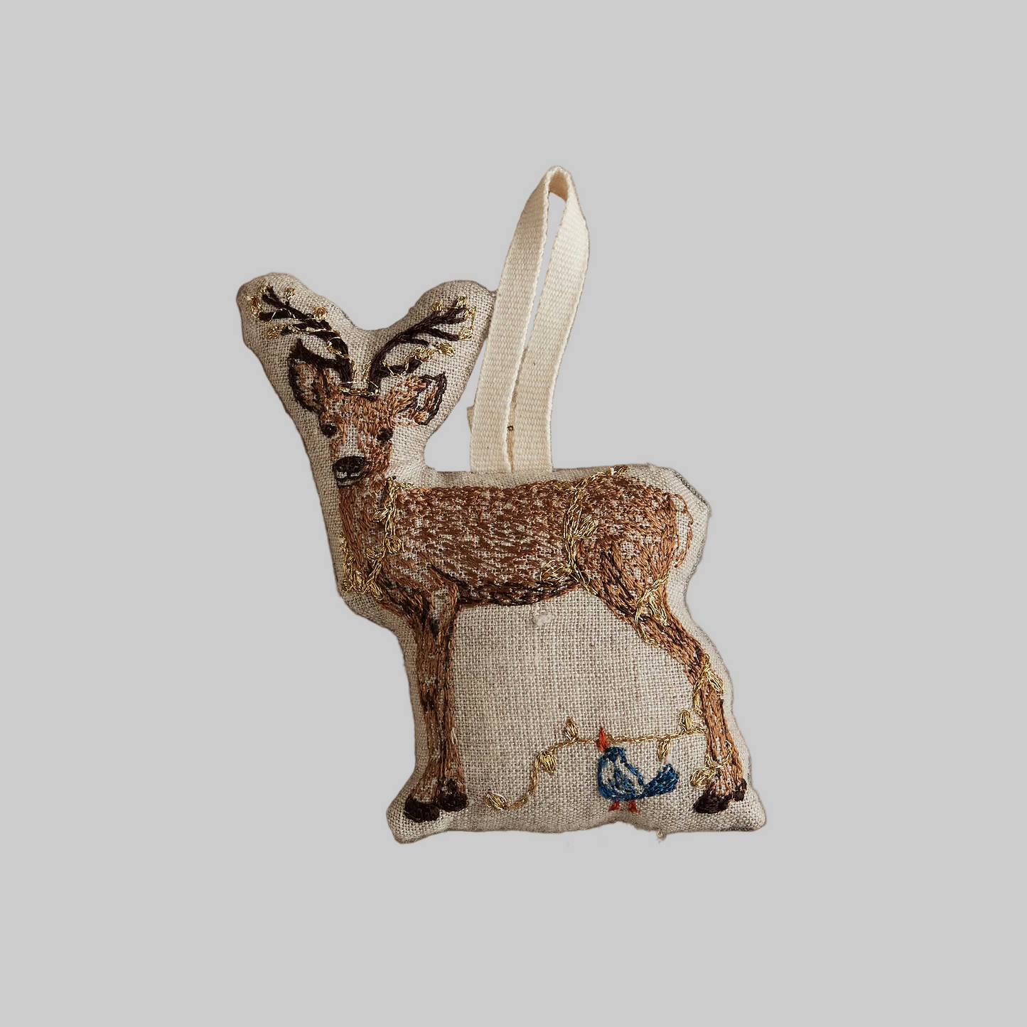 Coral and Tusk's "Deer with Lights" embroidered linen Christmas ornament featuring design of a deer wrapped in holiday lights