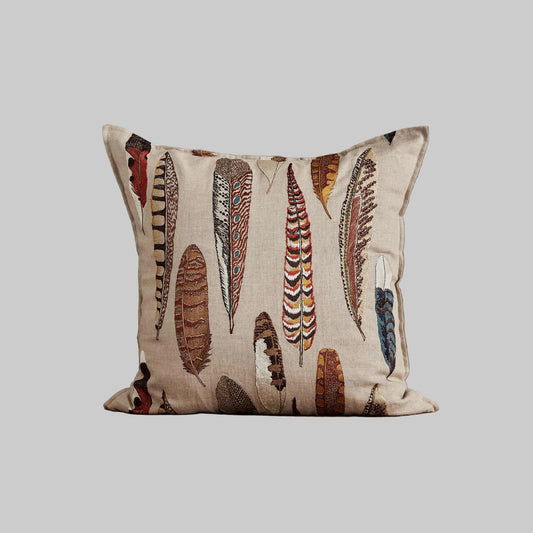 Coral and Tusk’s “Falling Feathers” embroidered linen pillow featuring large scale pheasant, kestrel and golden flicker feathers, measures 20” x 20”