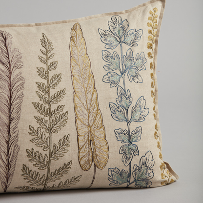 Coral and Tusk's "Plants" embroidered linen lumbar pillow featuring unsung garden heroes, including ferns, herbs, and ivy, measures 16" x 32"