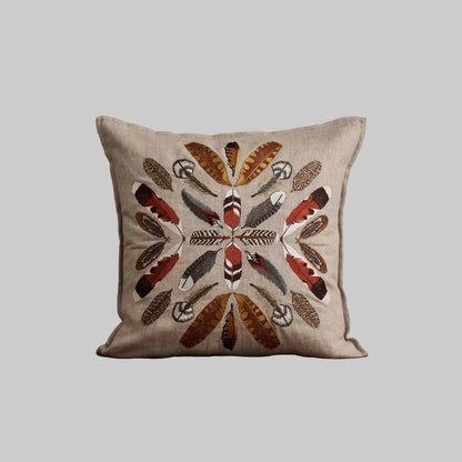 Coral and Tusk's embroidered linen "Feather Radiance" pillow designs of patterned bird feathers