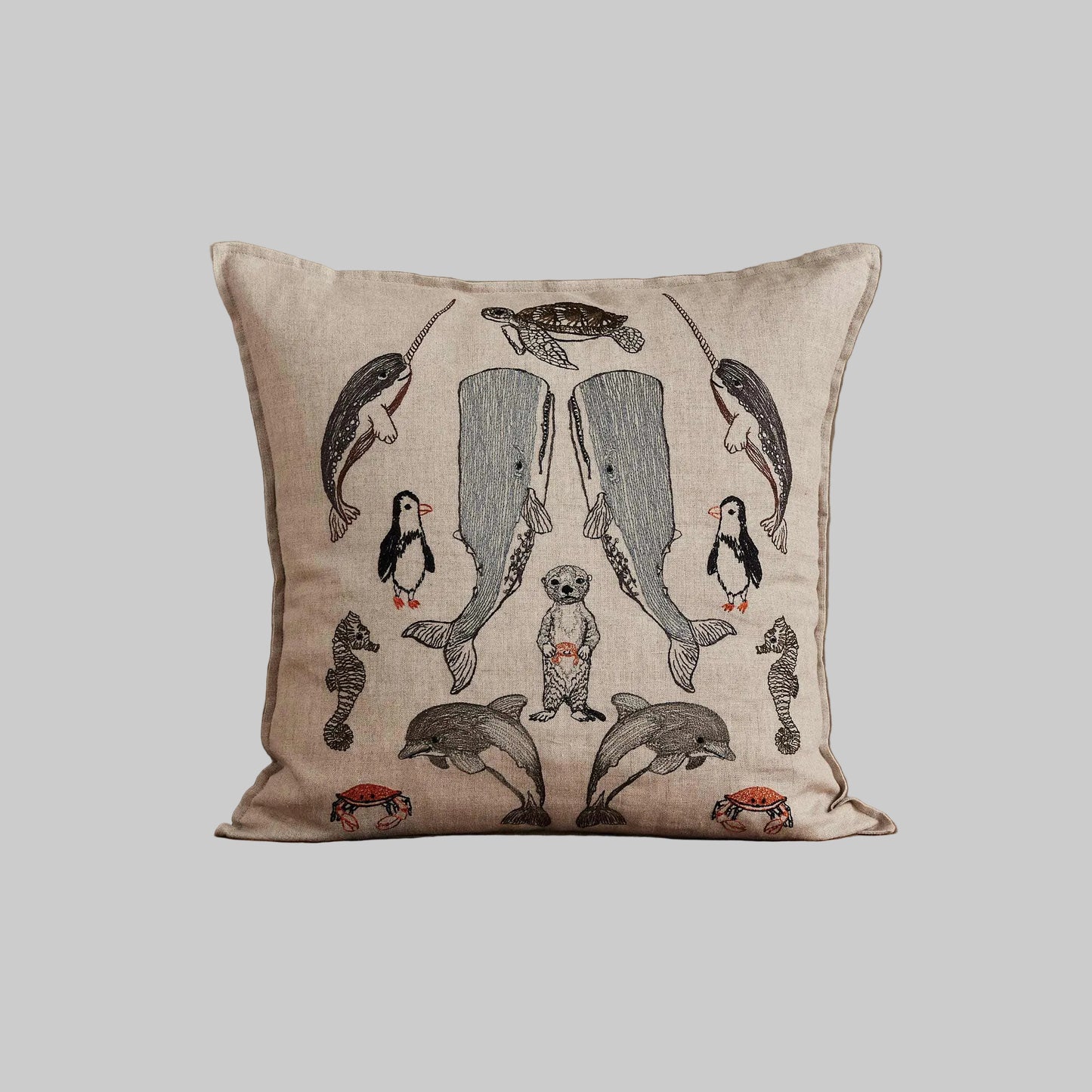 Coral and Tusk’s “Sea Friends” embroidered linen pillow featuring a variety of marine life found in oceans across the world, measures 16” x 16”