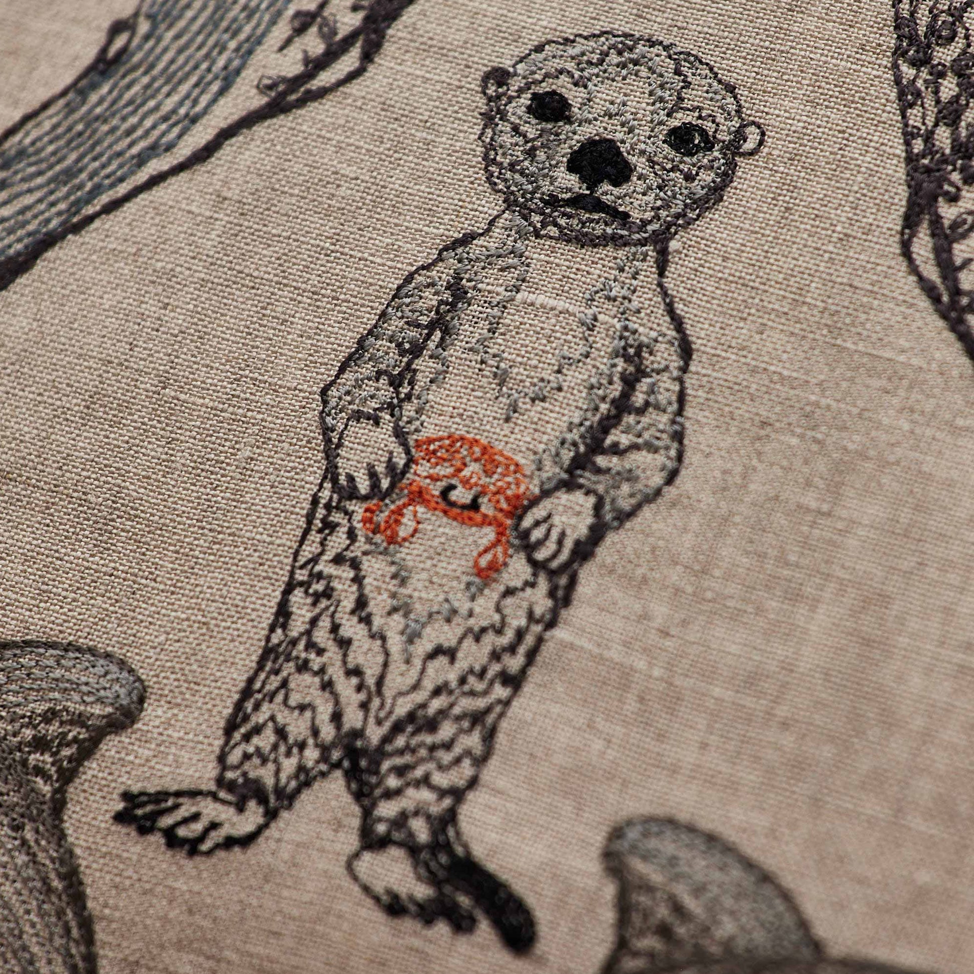 Coral and Tusk’s “Sea Friends” embroidered linen pillow featuring a variety of marine life found in oceans across the world, measures 16” x 16”