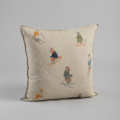 Coral and Tusk's "Downhill Skiers" embroidered linen pillow featuring five fun friends in colorful coats zipping down an alpine slope, measures 20" x 20"