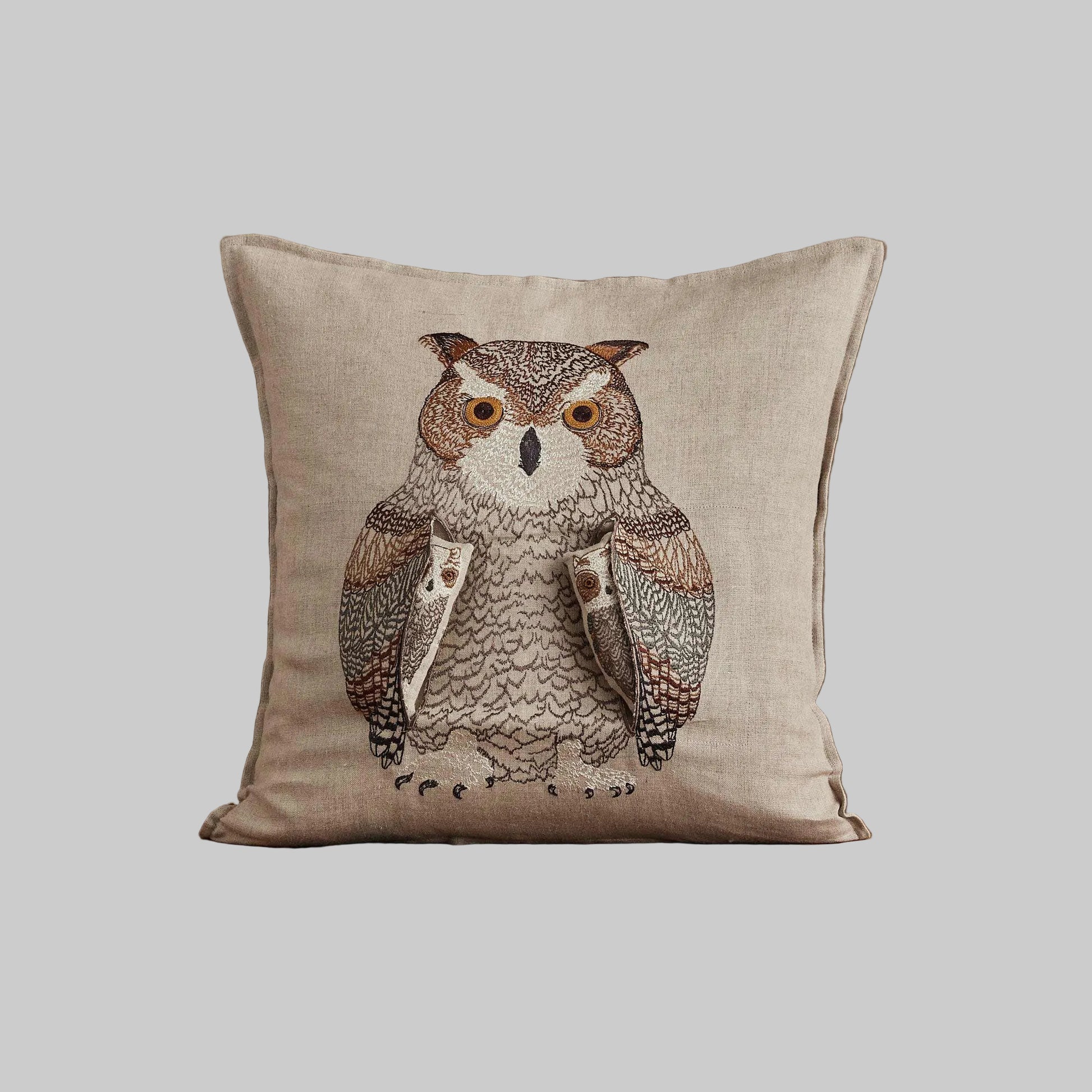 Coral and Tusk’s “Owl Mama” embroidered linen pocket pillow featuring a mother owl with removable owlets under each wing, measures 16” x 16”