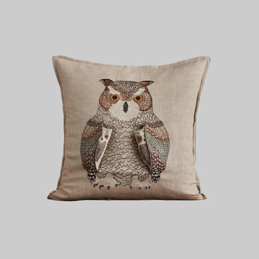 Coral and Tusk’s “Owl Mama” embroidered linen pocket pillow featuring a mother owl with removable owlets under each wing, measures 16” x 16”
