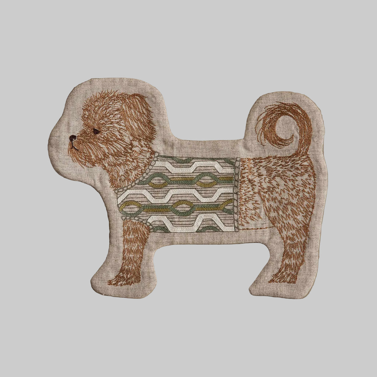 Coral and Tusk's Dog in Sweater pouch featuring a small brown dog in a festive sweater embroidered on 100% linen. 