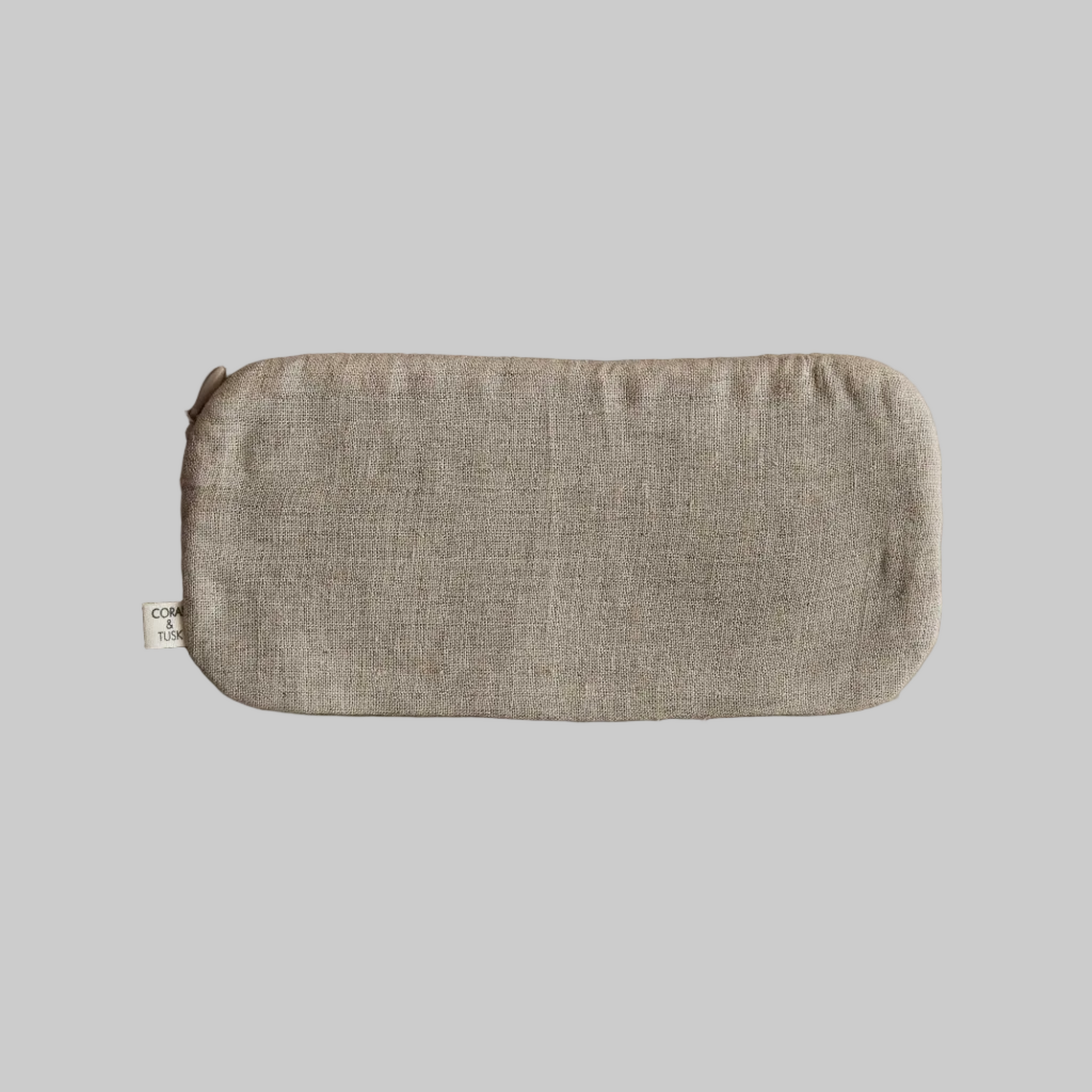Coral and Tusk's "Glasses" pouch embroidered with a black glasses design and blue eyes