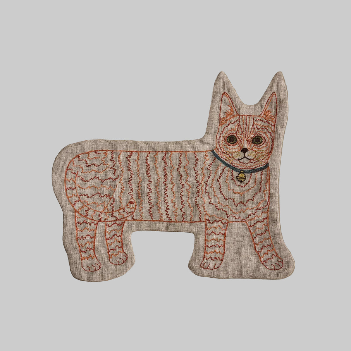Coral and Tusk's Orange Kitty pouch featuring an orange-striped tabby embroidered on 100% linen.