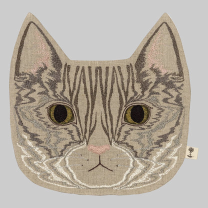 Coral and Tusk’s “Tabby Cat” embroidered linen pouch featuring a gray striped cat with bright green eyes