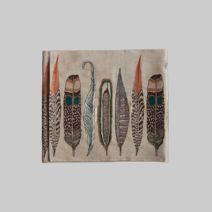 Coral and Tusk’s “Large Feathers” embroidered linen table runner featuring found feathers from a variety of birds