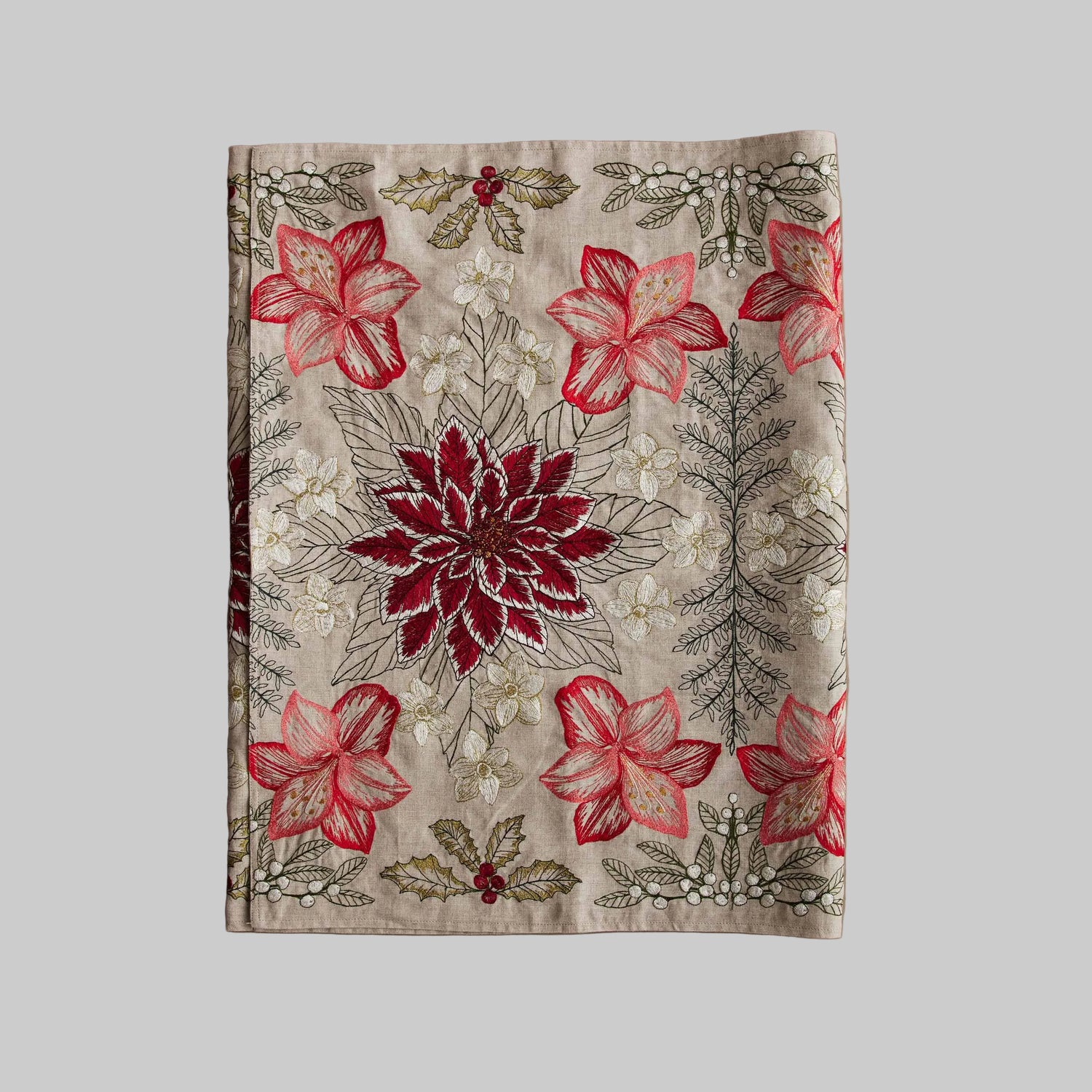 Coral and Tusk’s “Christmas Flowers” table runner featuring bold red and white florals