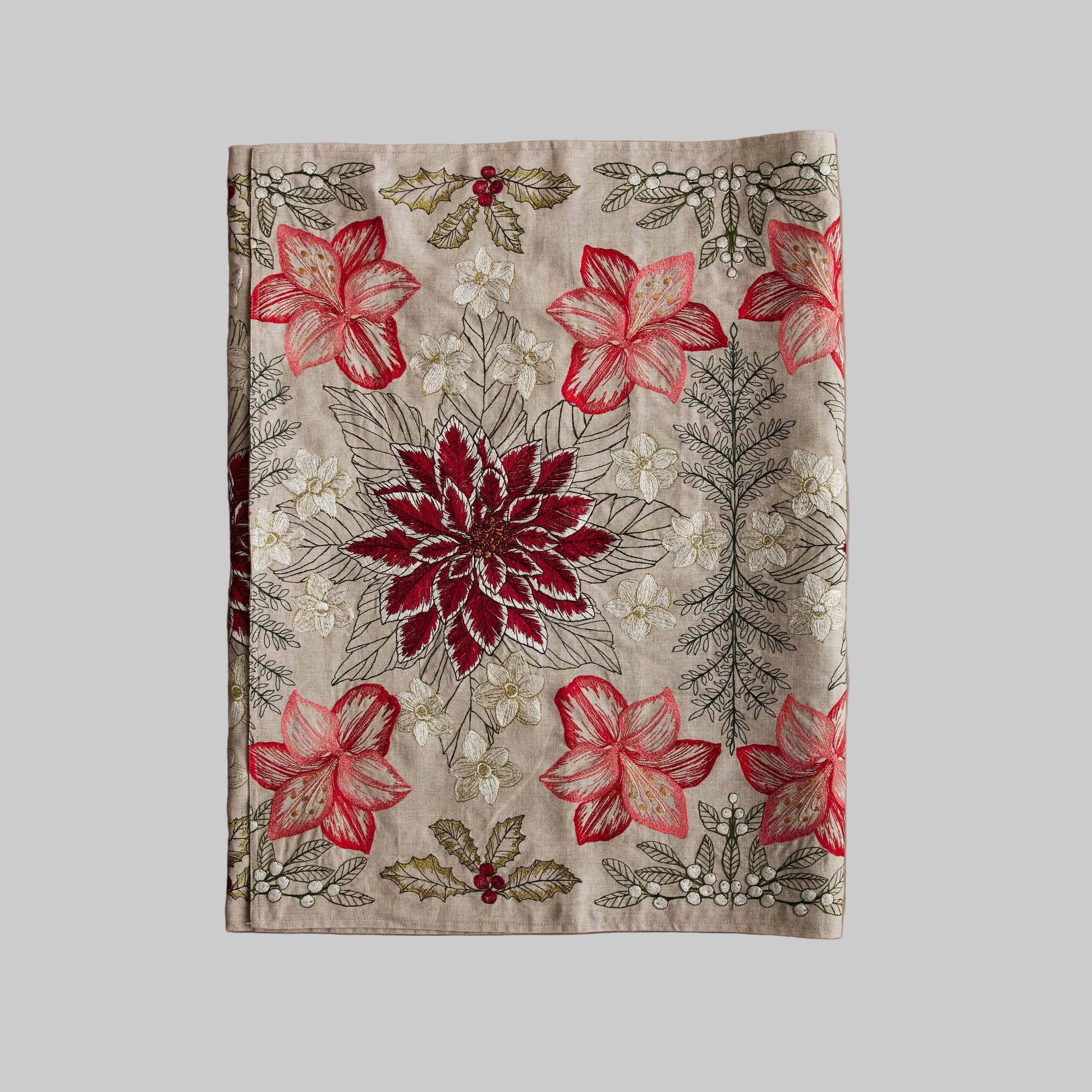 Coral and Tusk’s “Christmas Flowers” table runner featuring bold red and white florals