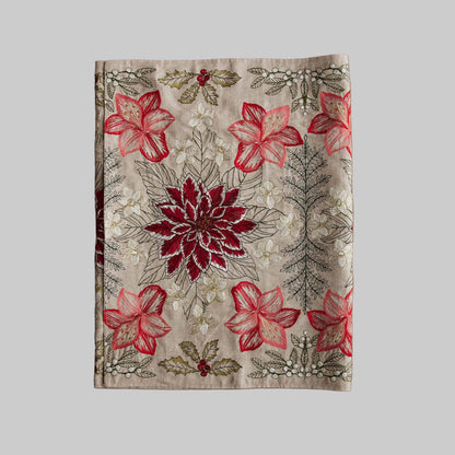 Coral and Tusk’s “Christmas Flowers” table runner featuring bold red and white florals