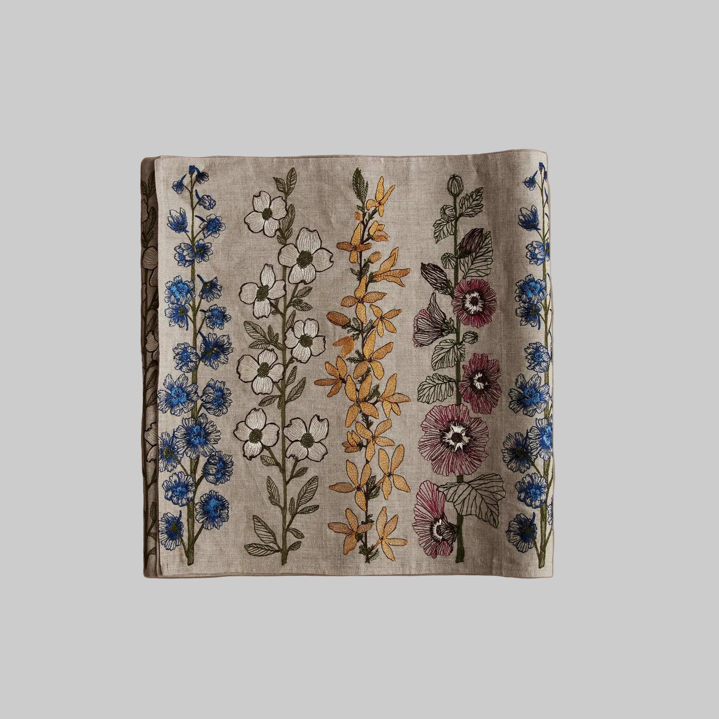 Coral and Tusk’s “Spring Stems” embroidered linen table runner featuring bold spring florals