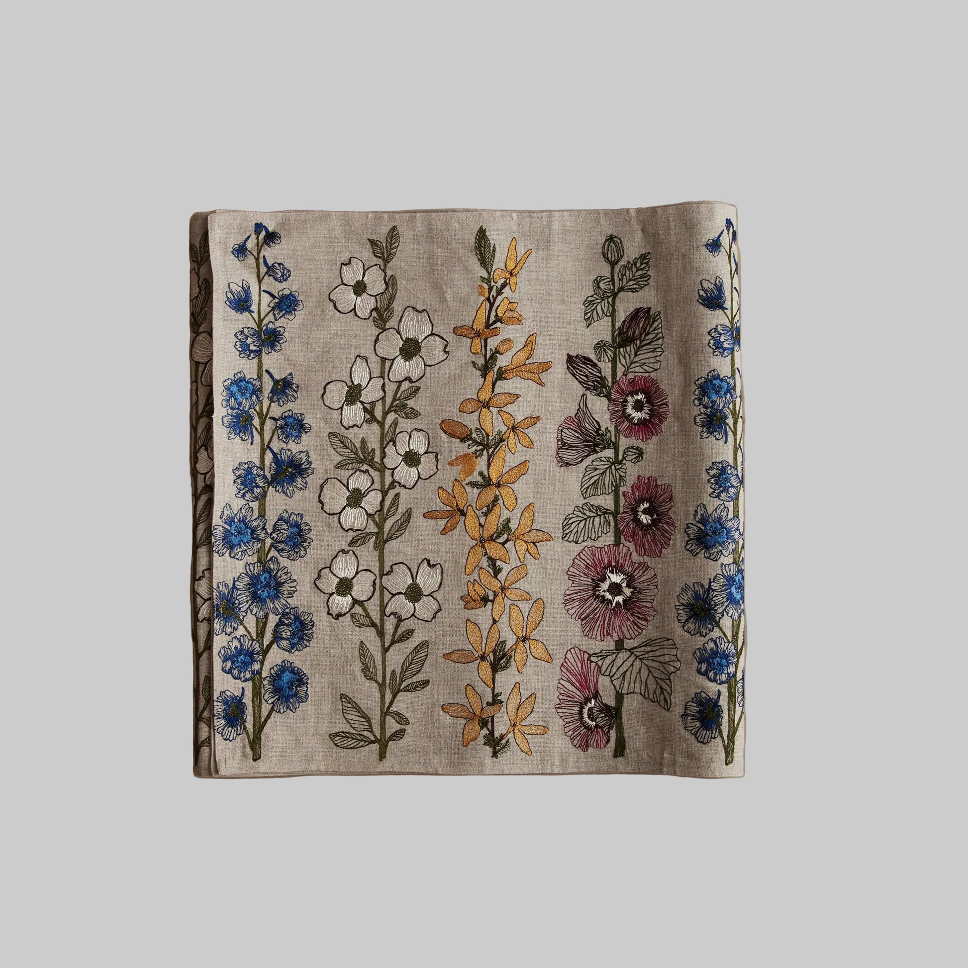 Coral and Tusk’s “Spring Stems” embroidered linen table runner featuring bold spring florals