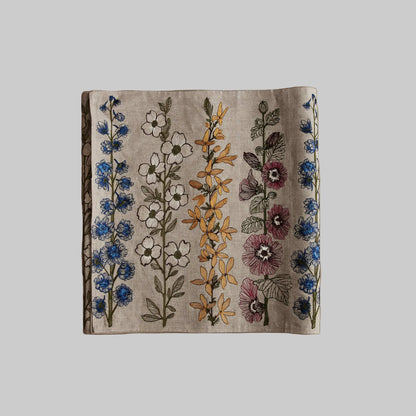 Coral and Tusk’s “Spring Stems” embroidered linen table runner featuring bold spring florals