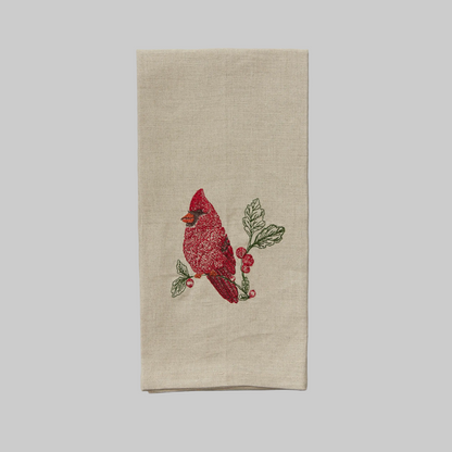 Coral and Tusk's "Red Cardinal" tea towel featuring a red cardinal on a holly branch