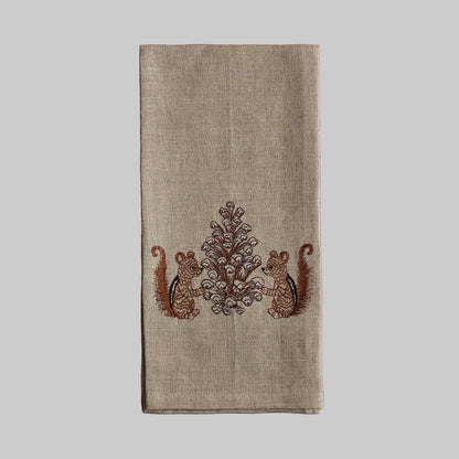 Coral and Tusk’s “Chipmunks with Pinecone” embroidered linen tea towel featuring two chipmunks holding a pinecone together