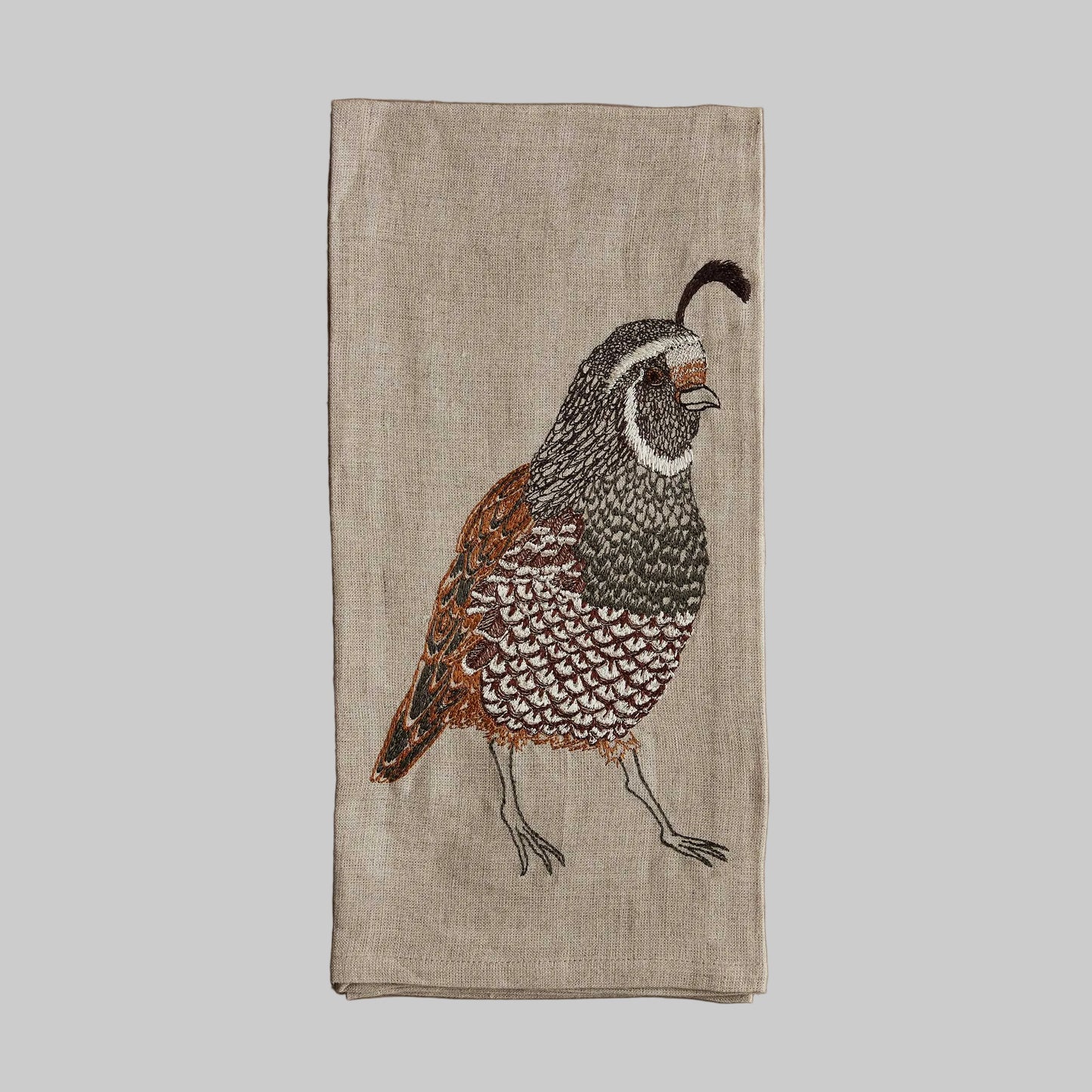 Coral and Tusk’s “Quail” embroidered linen tea towel