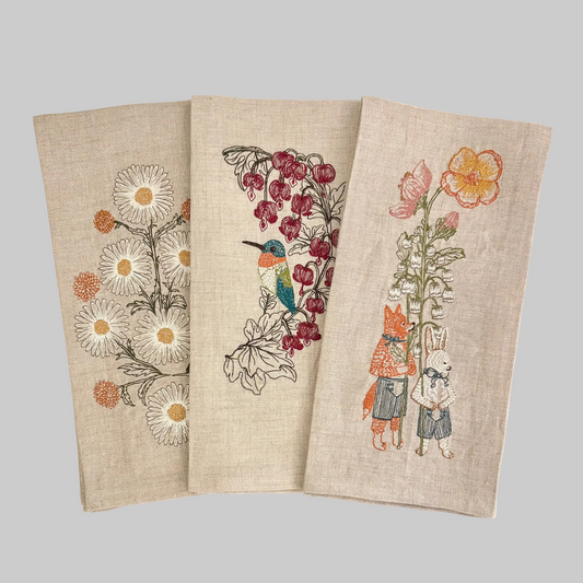 Coral and Tusk spring-themed embroidered linen tea towels