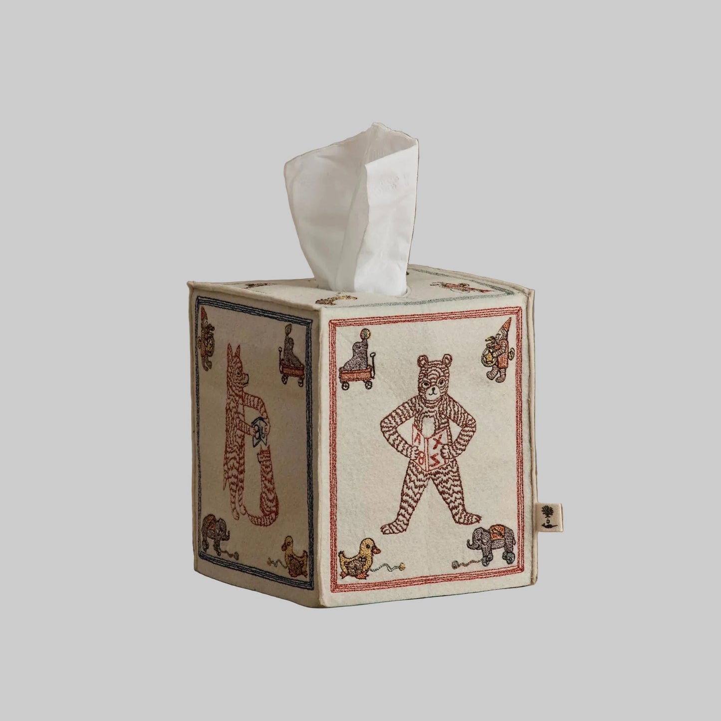 Coral and Tusk’s “ABC” embroidered felt tissue box cover featuring designs inspired by classic children’s building blocks