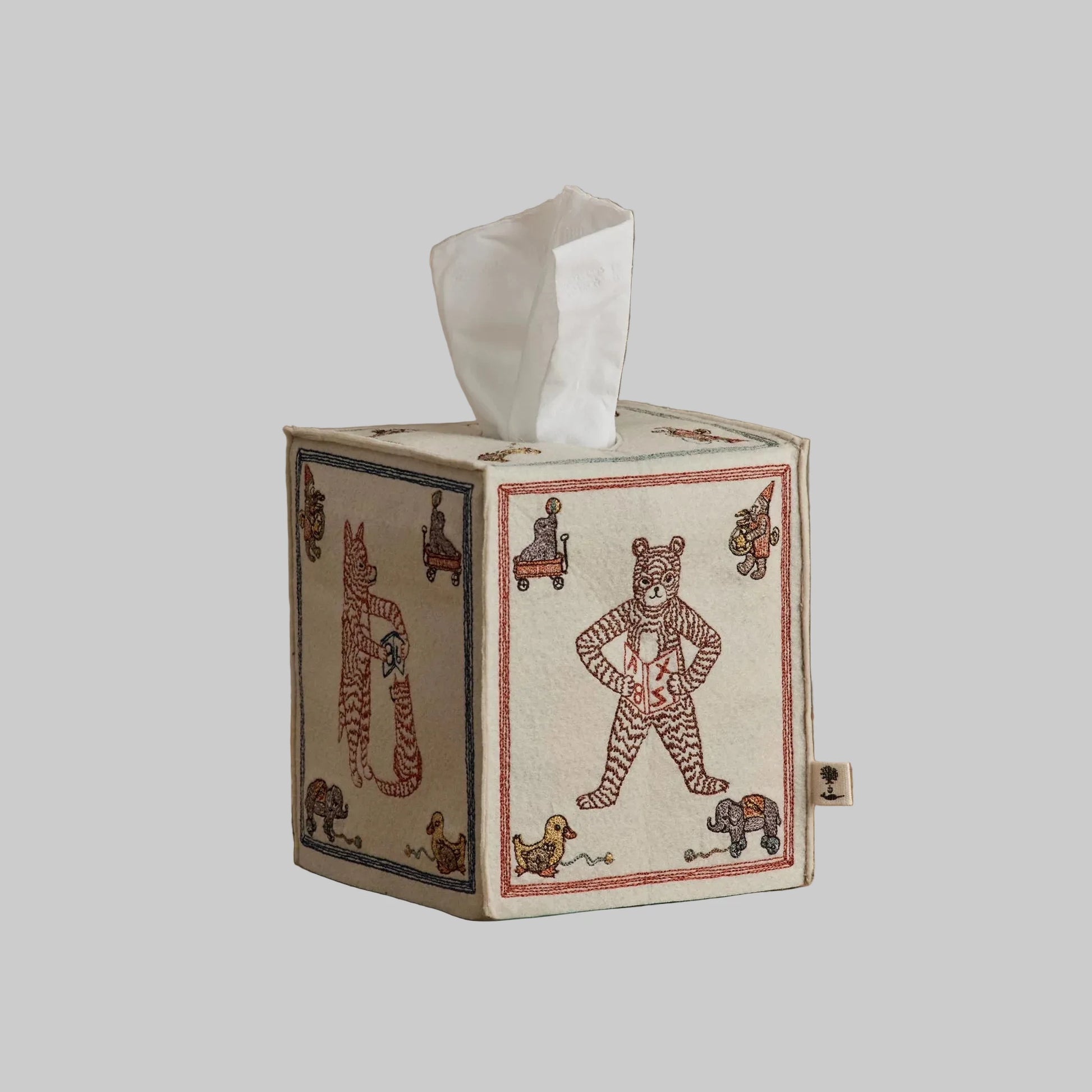 Coral and Tusk’s “ABC” embroidered felt tissue box cover featuring designs inspired by classic children’s building blocks