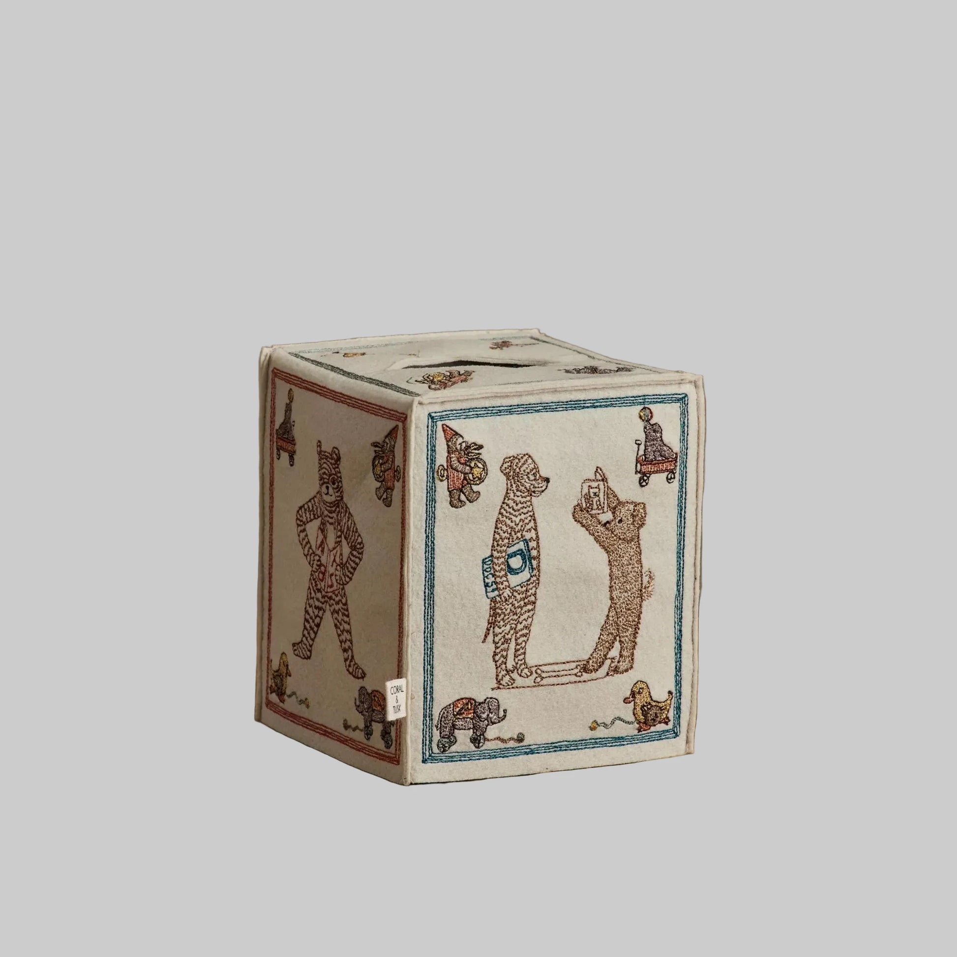 Coral and Tusk’s “ABC” embroidered felt tissue box cover featuring designs inspired by classic children’s building blocks