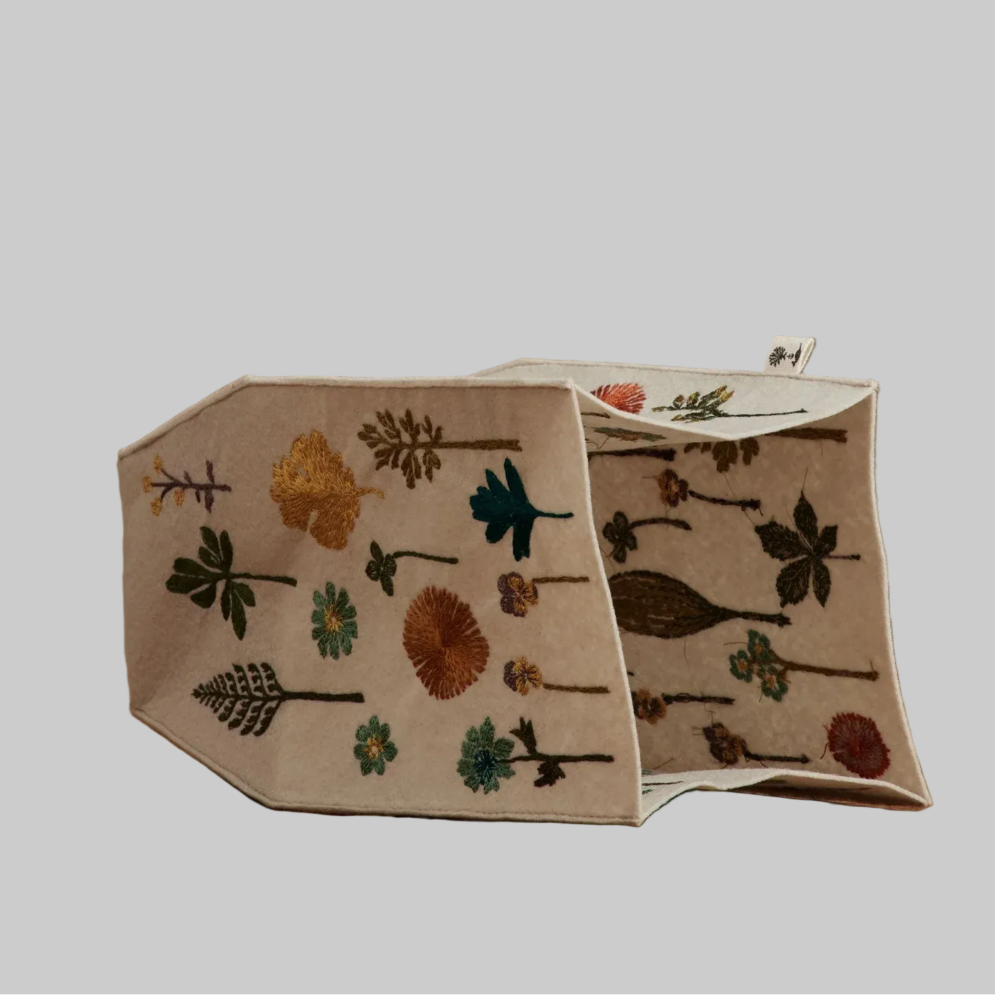 Coral and Tusk's "Garden" tissue box cover made of felt and embroidered with botanical designs