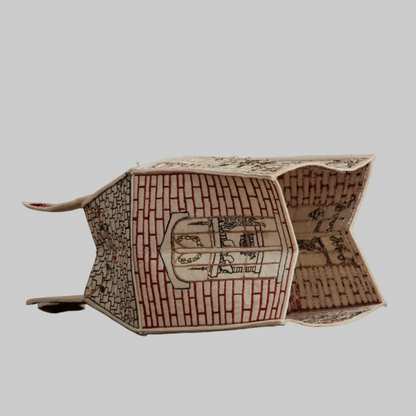 Coral and Tusk's "Home For the Holidays" tissue box cover made of felt and embroidered with festive Christmas designs