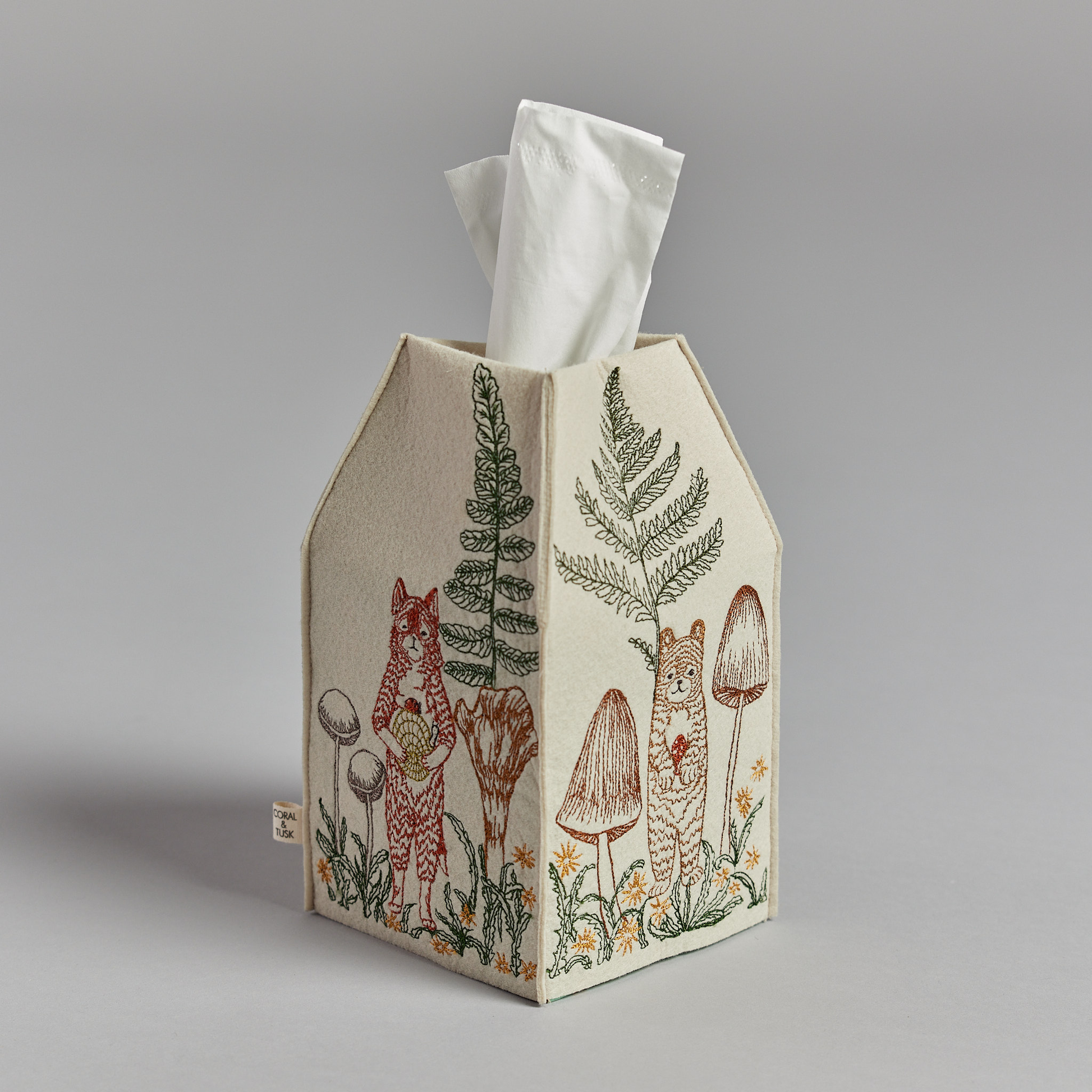 Coral and Tusk's "Mushrooms and Ferns" tissue box cover made of felt and embroidered with animal, mushroom, and fern designs