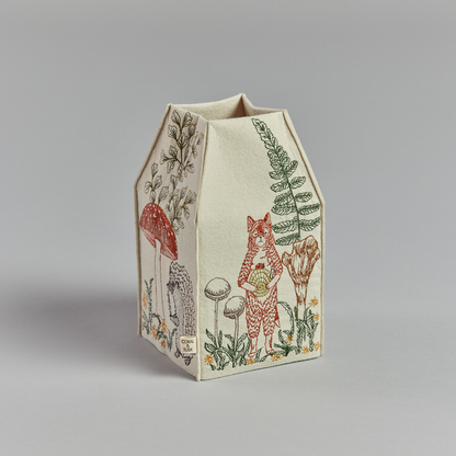 Coral and Tusk's "Mushrooms and Ferns" tissue box cover made of felt and embroidered with animal, mushroom, and fern designs