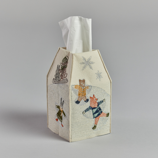 Coral and Tusk's "Snow Day" tissue box cover made of felt and embroidered with animals playing in the snow design