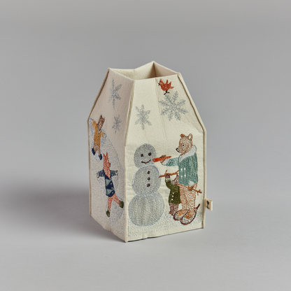 Coral and Tusk's "Snow Day" tissue box cover made of felt and embroidered with animals playing in the snow design