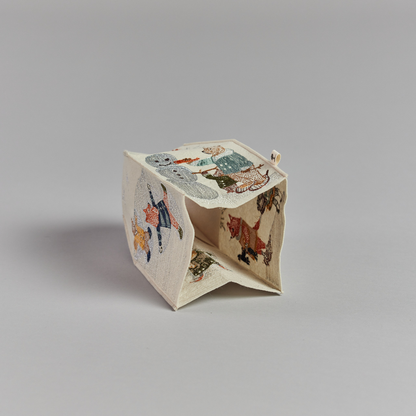 Coral and Tusk's "Snow Day" tissue box cover made of felt and embroidered with animals playing in the snow design