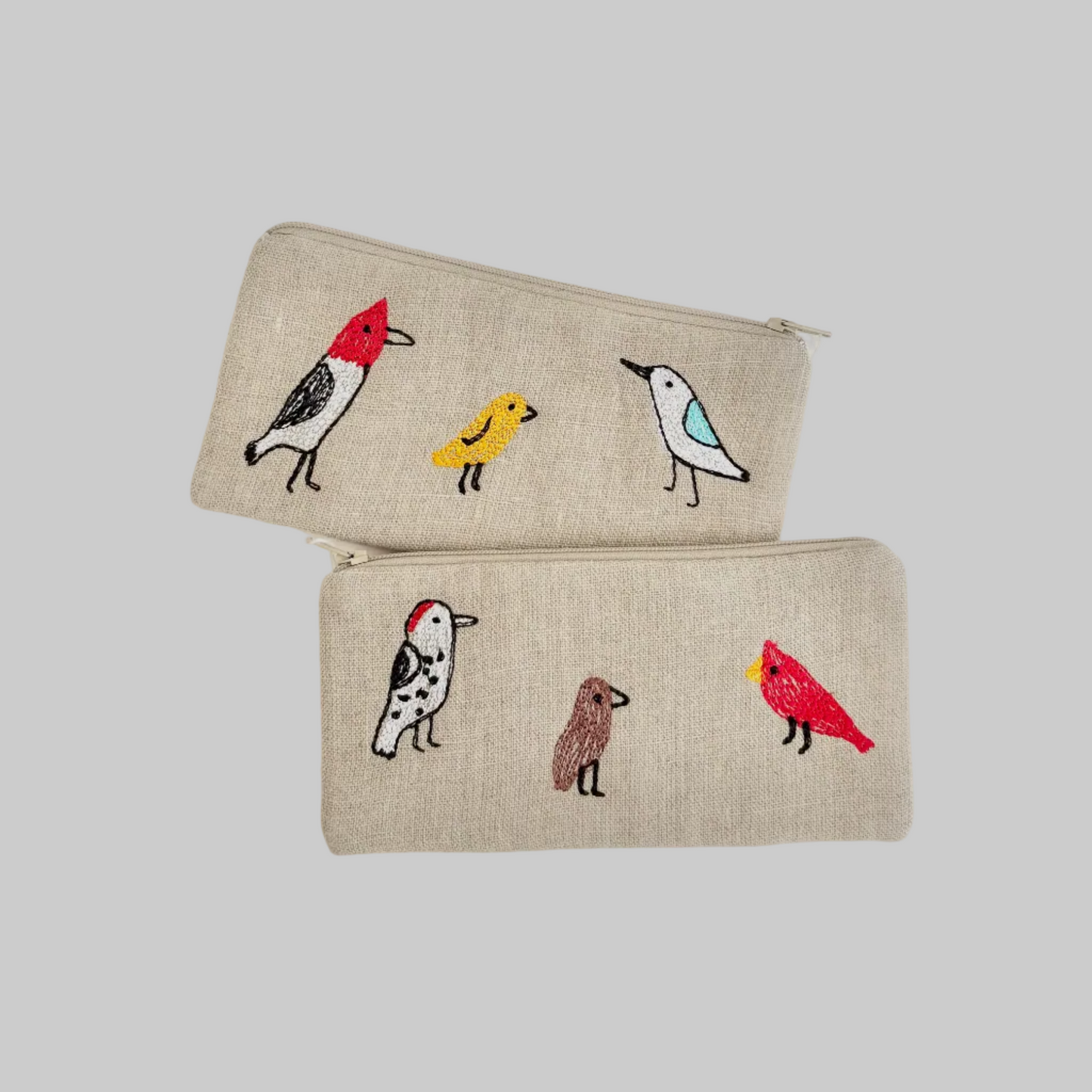 K. Studio’s flax pouches with embroidered backyard bird designs and metal zippers
