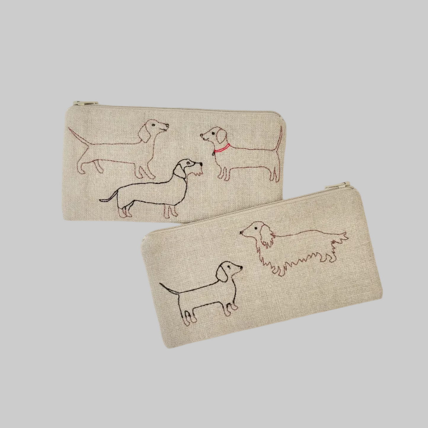 K. Studio’s flax pouches with embroidered dachshund designs and metal zippers
