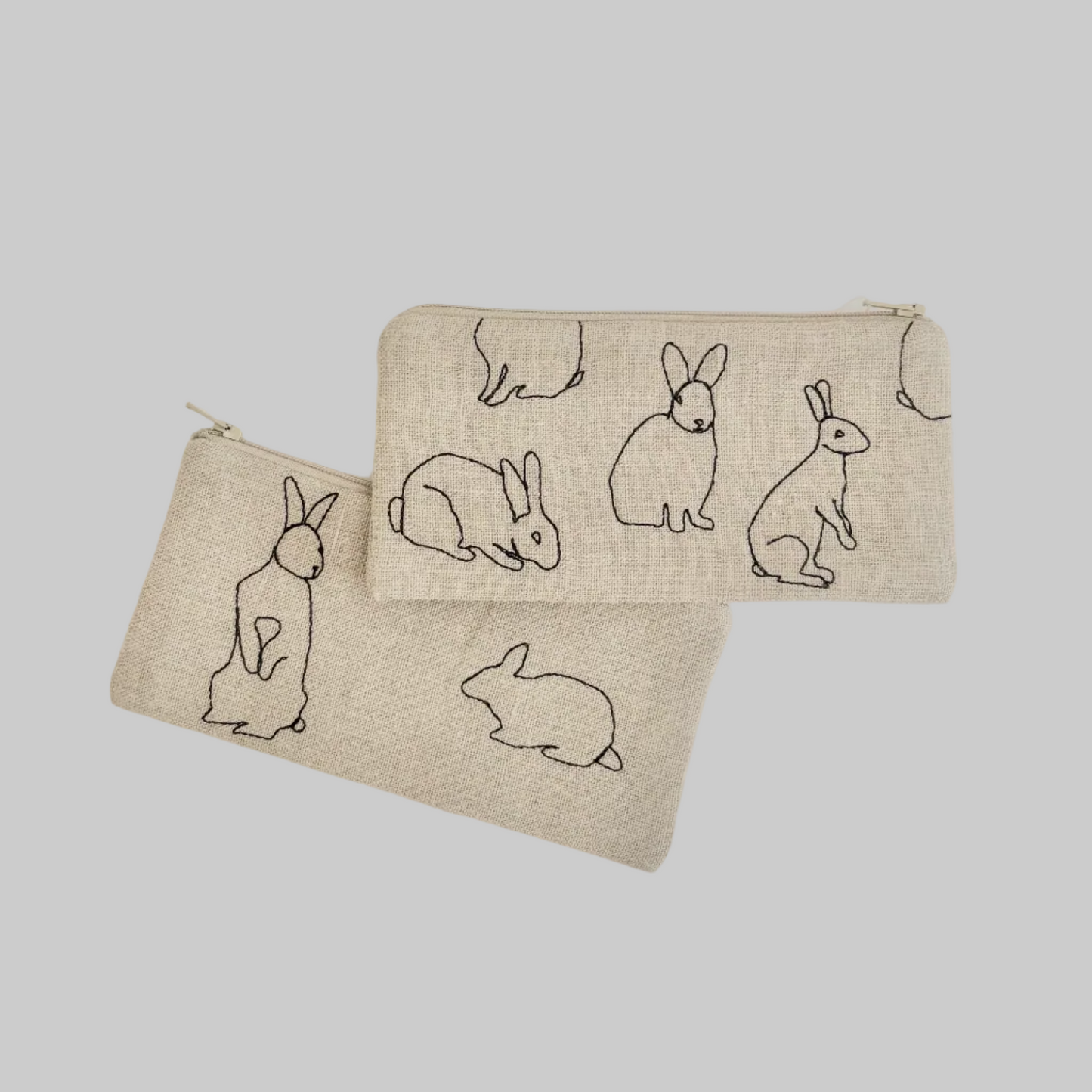 K. Studio’s flax pouches with embroidered rabbit silhouette designs and metal zippers