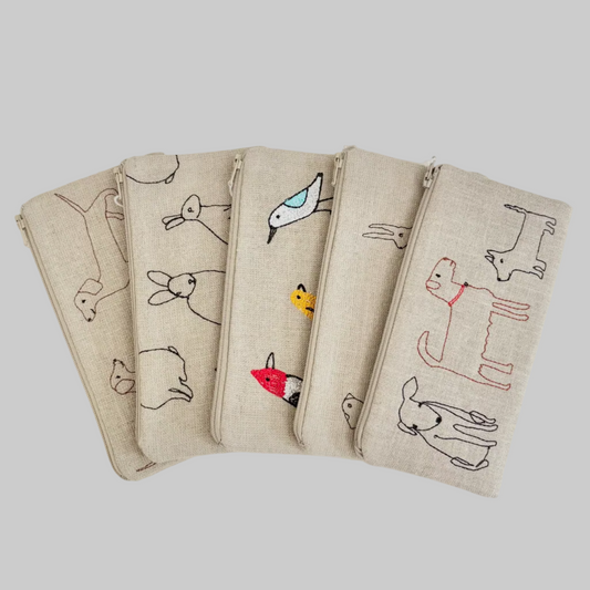 K. Studio’s flax pouches with playful embroidered designs and metal zippers