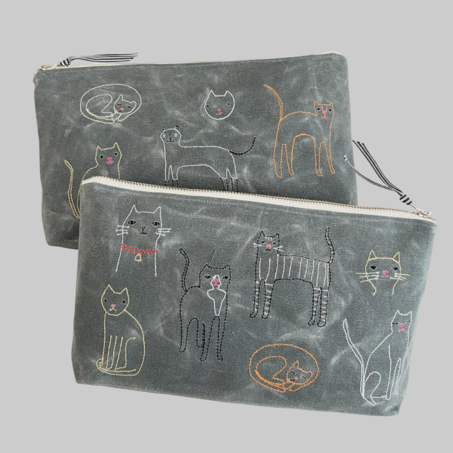 K. Studio’s waxed canvas pouches with embroidered cat breed designs and metal zippers