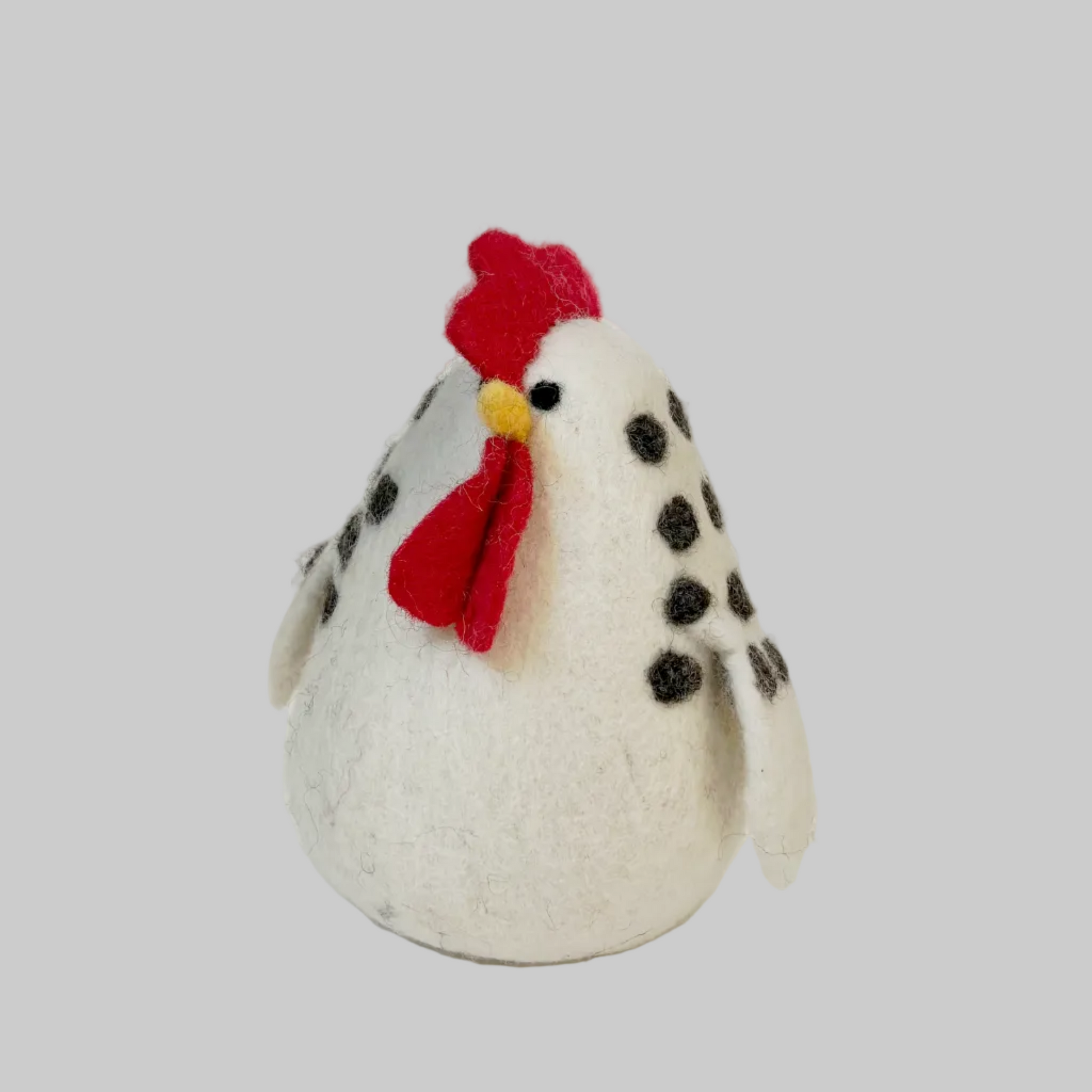 The Winding Road’s wool-felted white chicken with black spots, fair trade 