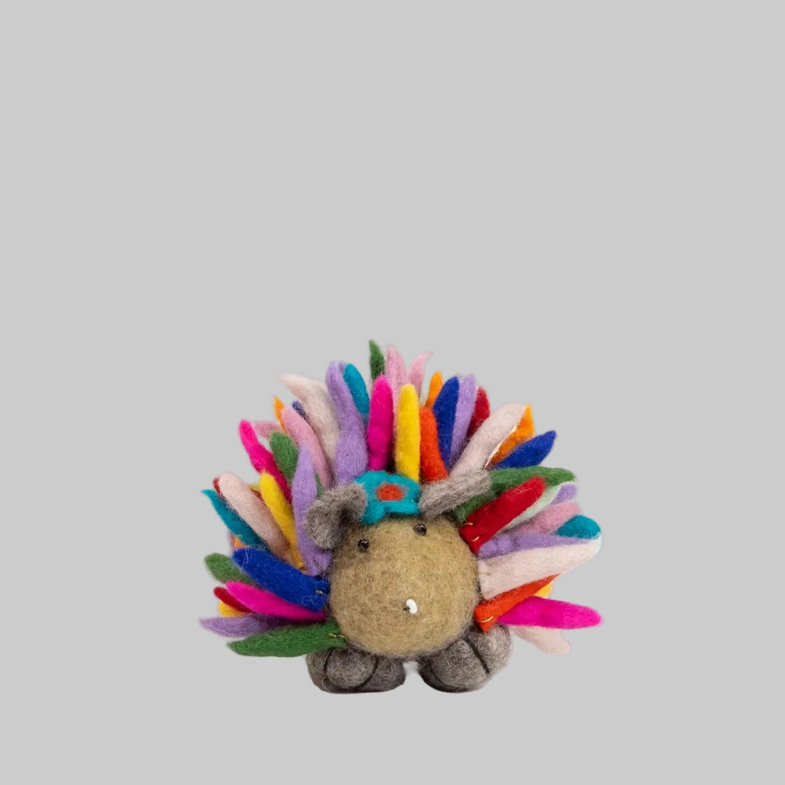 Small felted hedgehog with rainbow quills from The Winding Road. Fair trade and made of 100% wool.