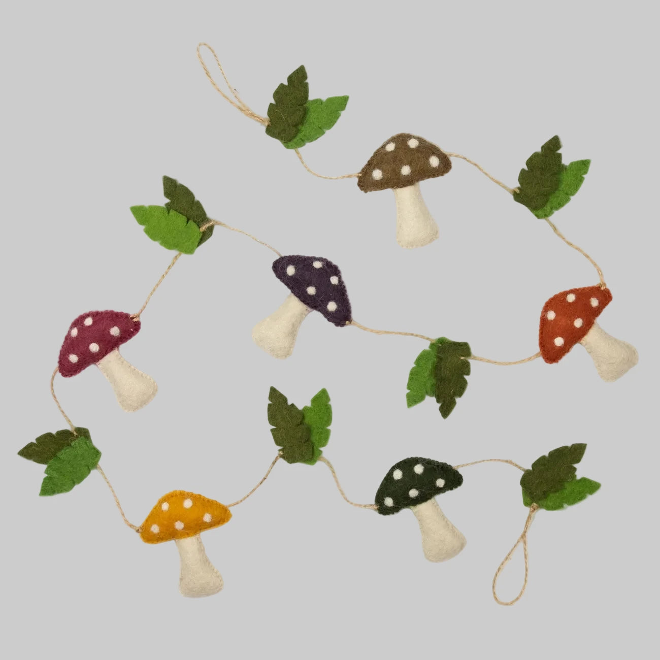 Wool-felted garland from The Winding Road featuring natural colored mushrooms and leaves, use for house decor or kids room