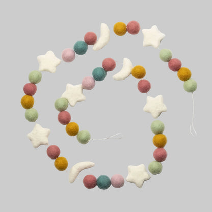 Wool-felted garland from The Winding Road featuring pastel beads and white moons and stars, use for house decor or kids room