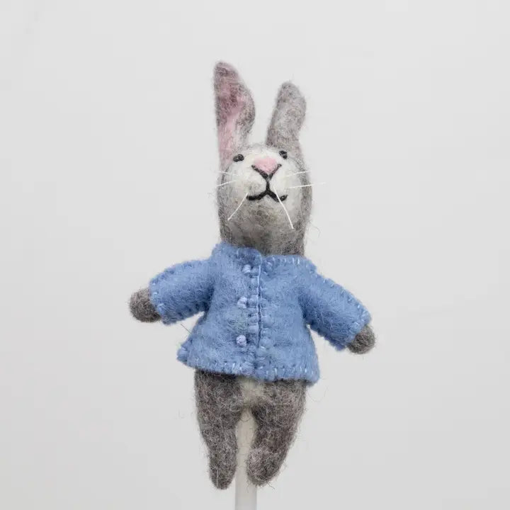 The Winding Road’s wool-felted bunny finger puppet wearing a blue jacket