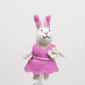 The Winding Road’s wool felted bunny finger puppet wearing a pink dress