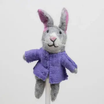 The Winding Road’s wool-felted bunny finger puppet wearing a purple jacket