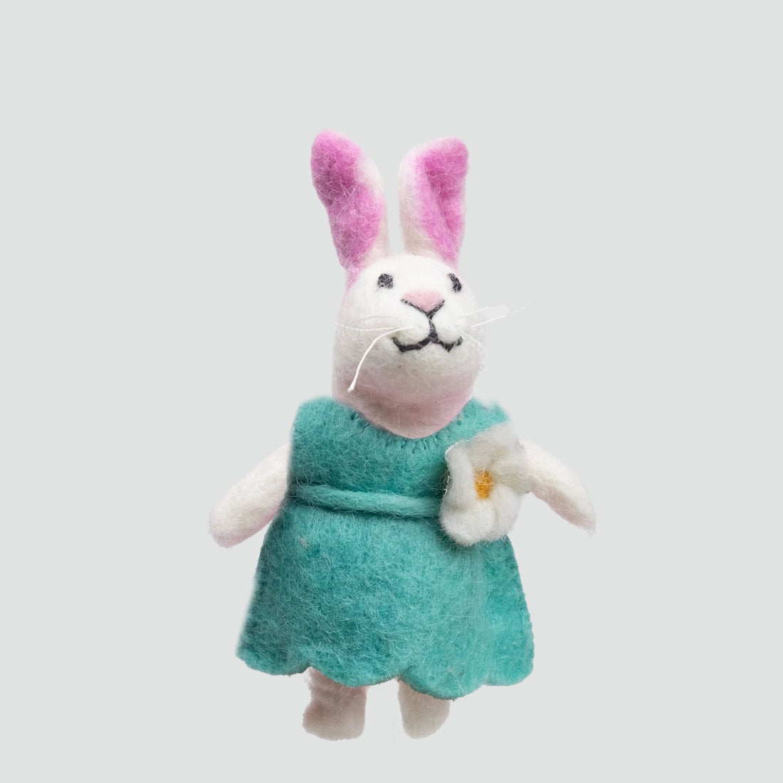 The Winding Road’s wool-felted bunny finger puppet wearing a teal dress