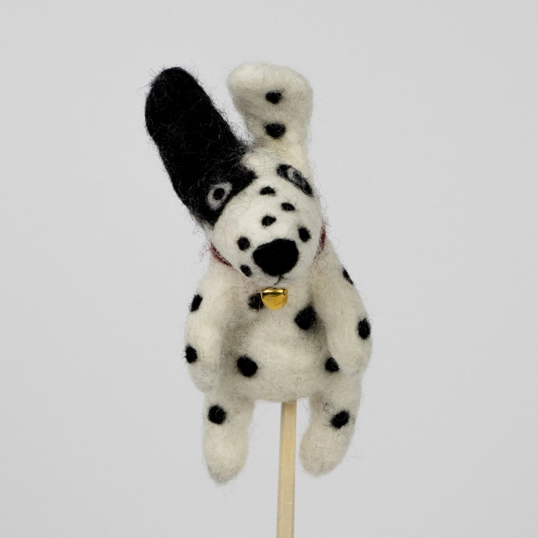 The Winding Road’s wool-felted spotted dog finger puppet